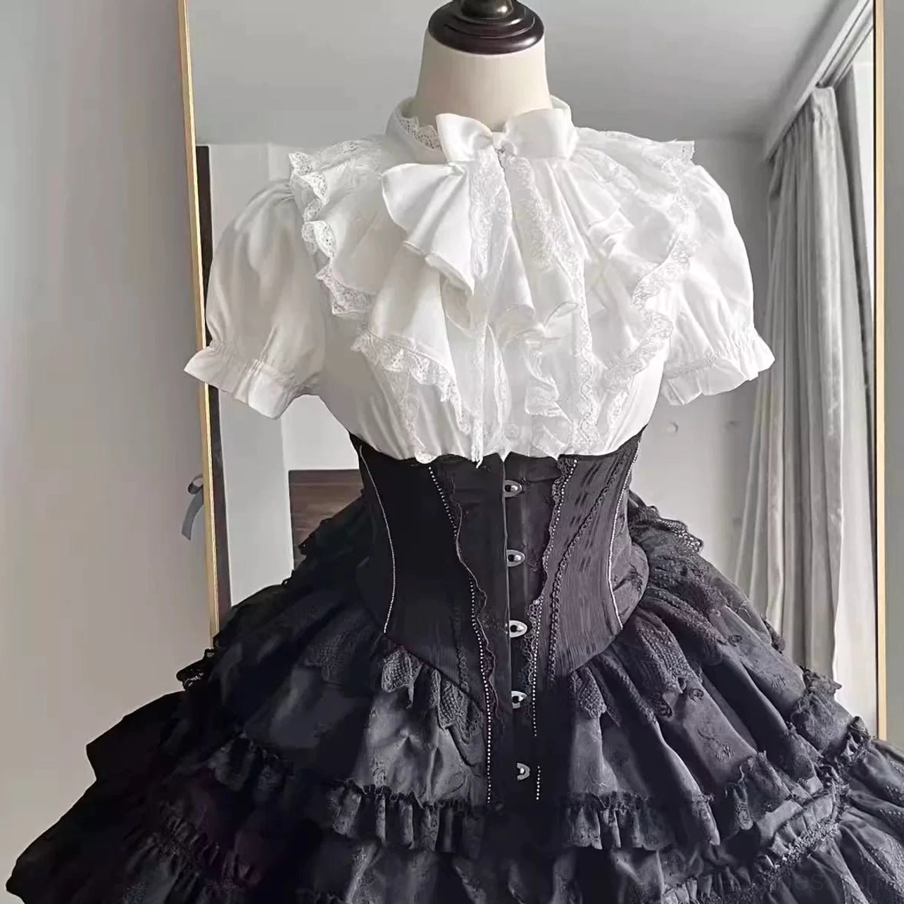 White gothic lolita blouse with detachable flared sleeves and optional jabot neckline close-up detail