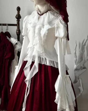 White gothic lolita blouse with hime sleeves and layered ruffle collar, mannequin display showing translucent satin chiffon construction with lace-trimmed details