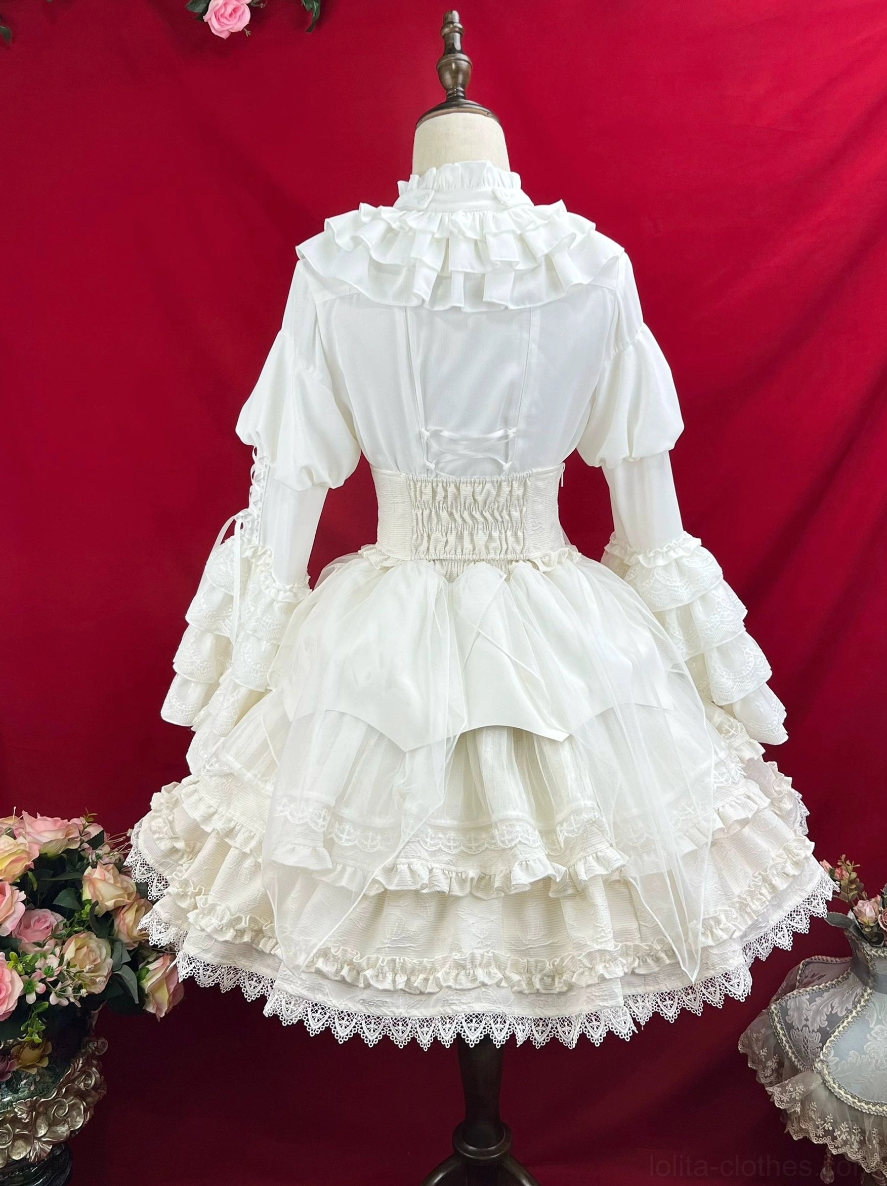 White gothic lolita princess dress showing delicate lace accents ribbon details tiered ruffled skirt and refined Victorian-inspired silhouette complete view