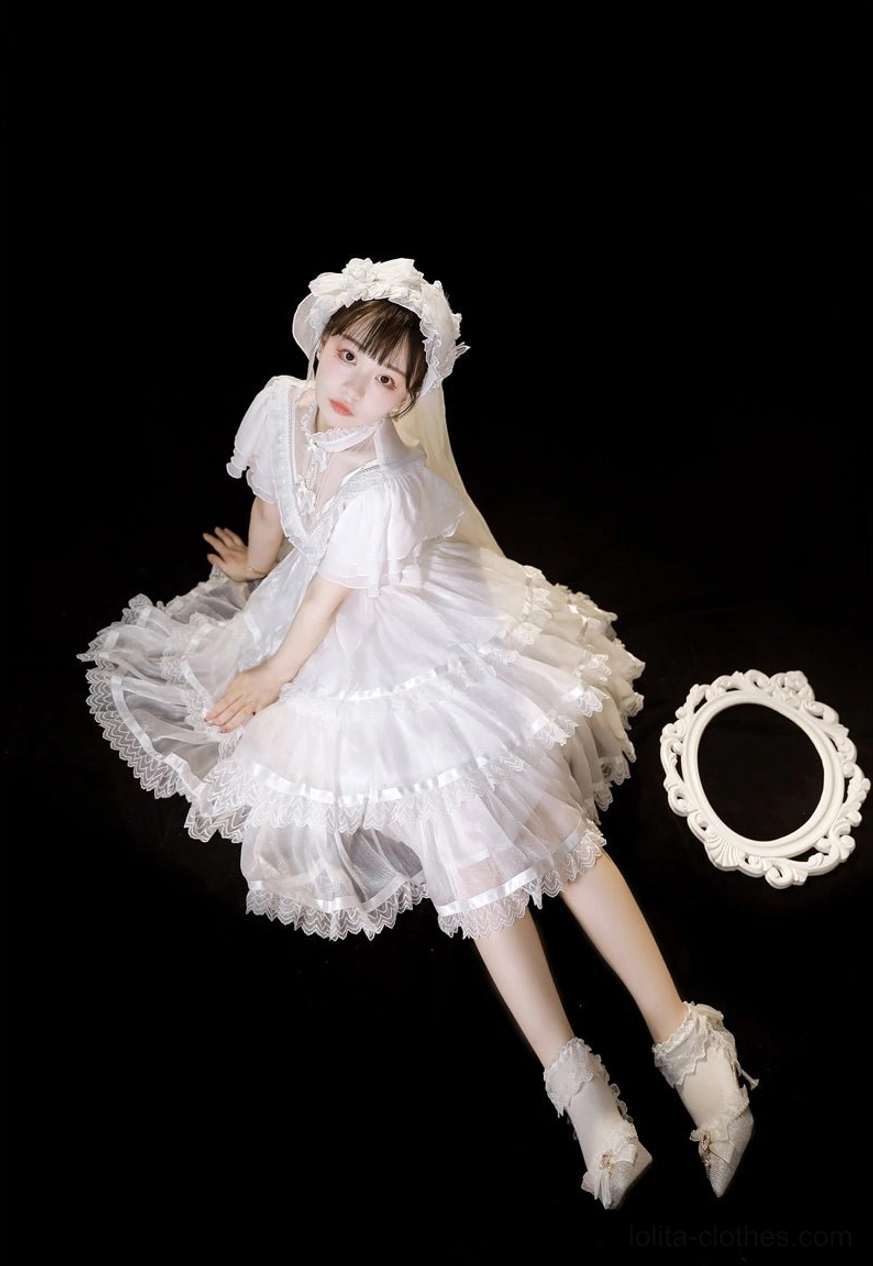 white gothic lolita one-piece dress lying down overhead shot veil decorative frame