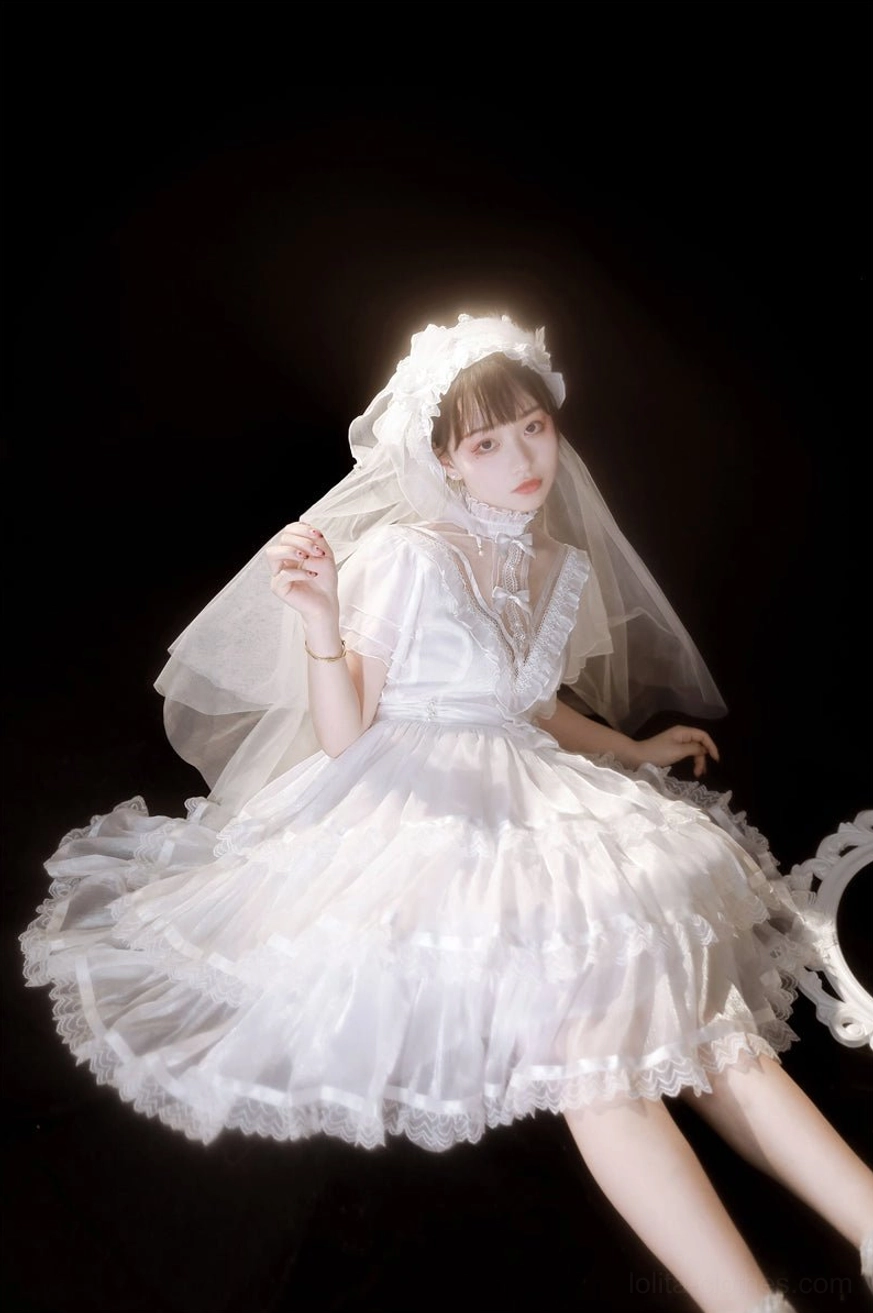 white gothic lolita one-piece dress side sitting view vintage furniture romantic