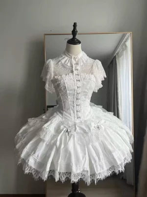 White gothic lolita fishbone corset skirt set with lace shirt front view, featuring short ruffled lace sleeves, stand collar, front metal hook fasteners, and ornamental cross embellishments on the double-layer lace-edged skirt