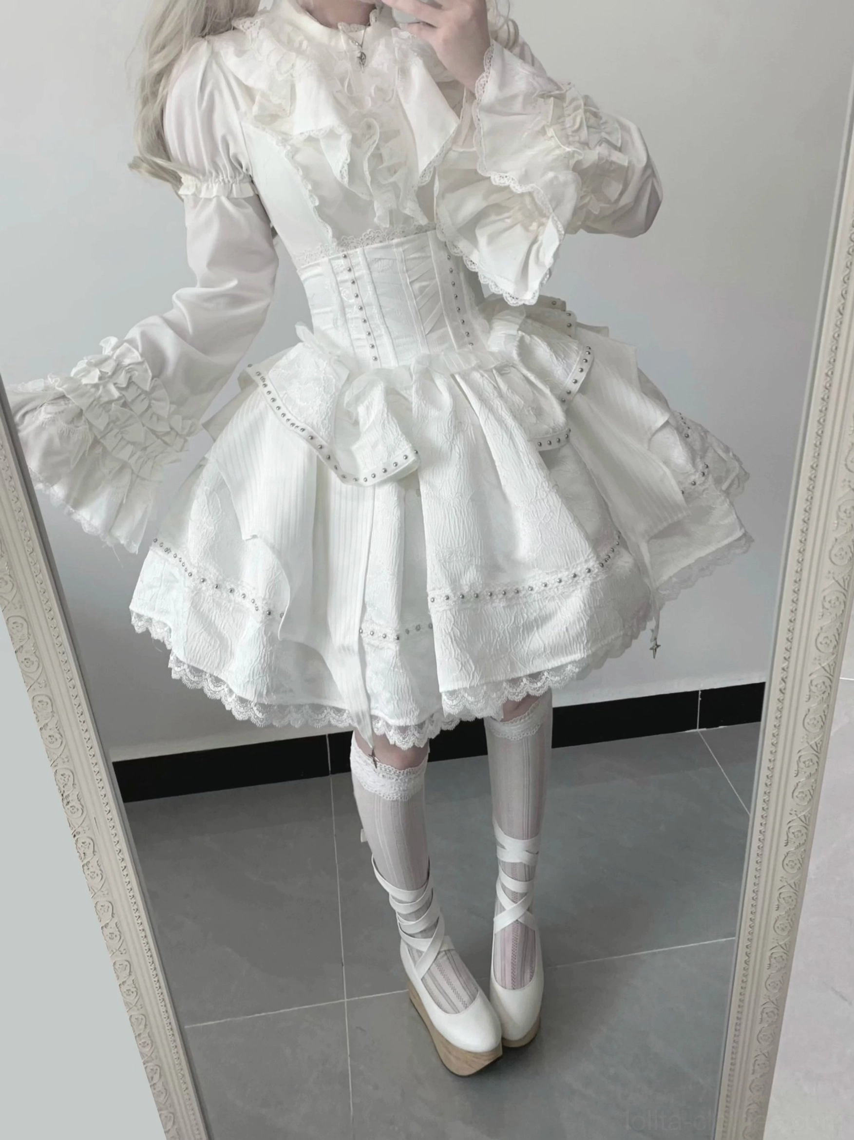 White gothic lolita op dress with ruffled flared long sleeves corset waist and layered mini skirt full view