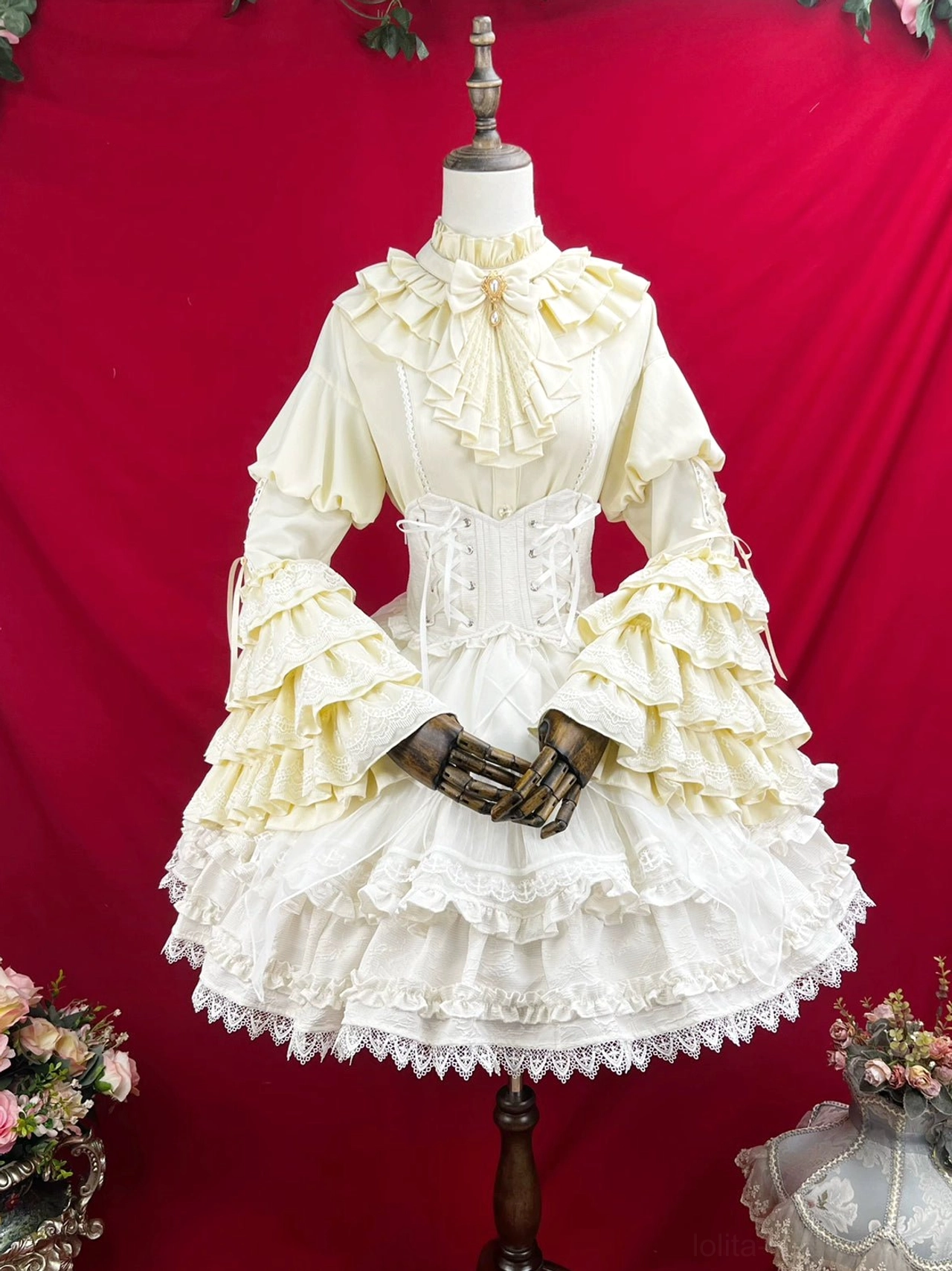 White gothic lolita dress princess sleeve close-up showing puff construction large bell flare delicate lace edging and refined Victorian-inspired tailoring