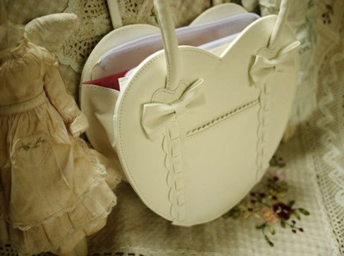 Cream white heart-shaped Lolita tote bag back interior view red fabric lining top zipper cream bow shoulder straps