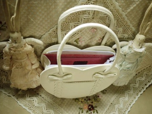Cream white heart-shaped Lolita tote bag overhead interior close-up showing red inner lining dual handles streamlined silhouette