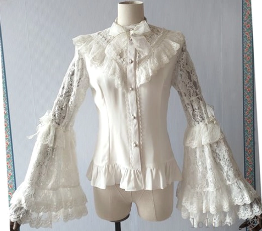 Front view from slightly low angle of white Lolita hime sleeve blouse displaying ruffled stand collar with bow tie, pearl front buttons, layered lace trumpet sleeves, ruffled shirt hem, and side sleeve bows