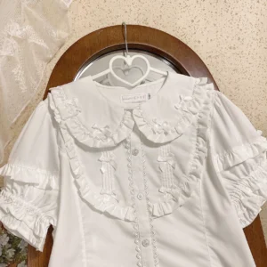 Pure white short sleeve lolita blouse with double layer ruffled doll collar tiny satin bows and layered sleeves hanging on heart hanger