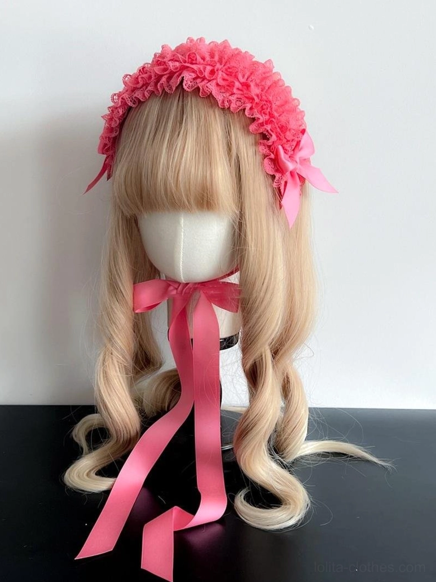White lace KC headdress on mannequin with brown twin ponytails, displaying classic white ruffled lace with elegant satin bow and flowing ribbon
