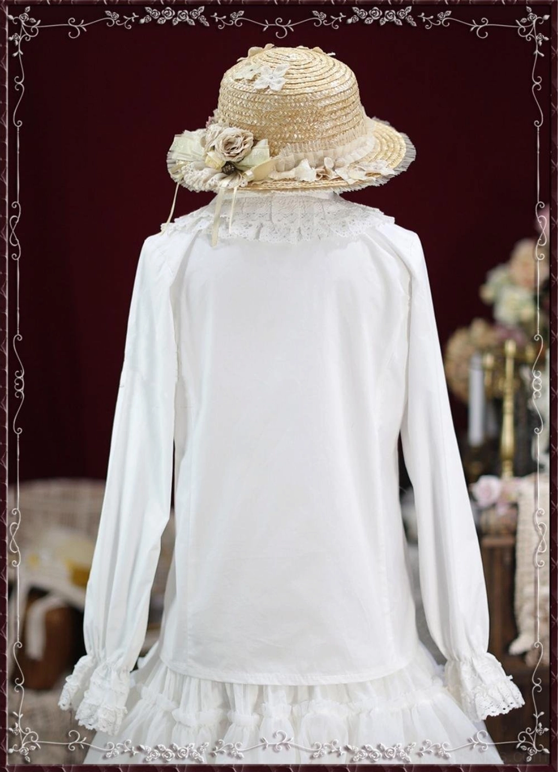 White vintage lace Lolita blouse back view on dress form showing plain back panel flared lace cuffs and ruffled underskirt detail