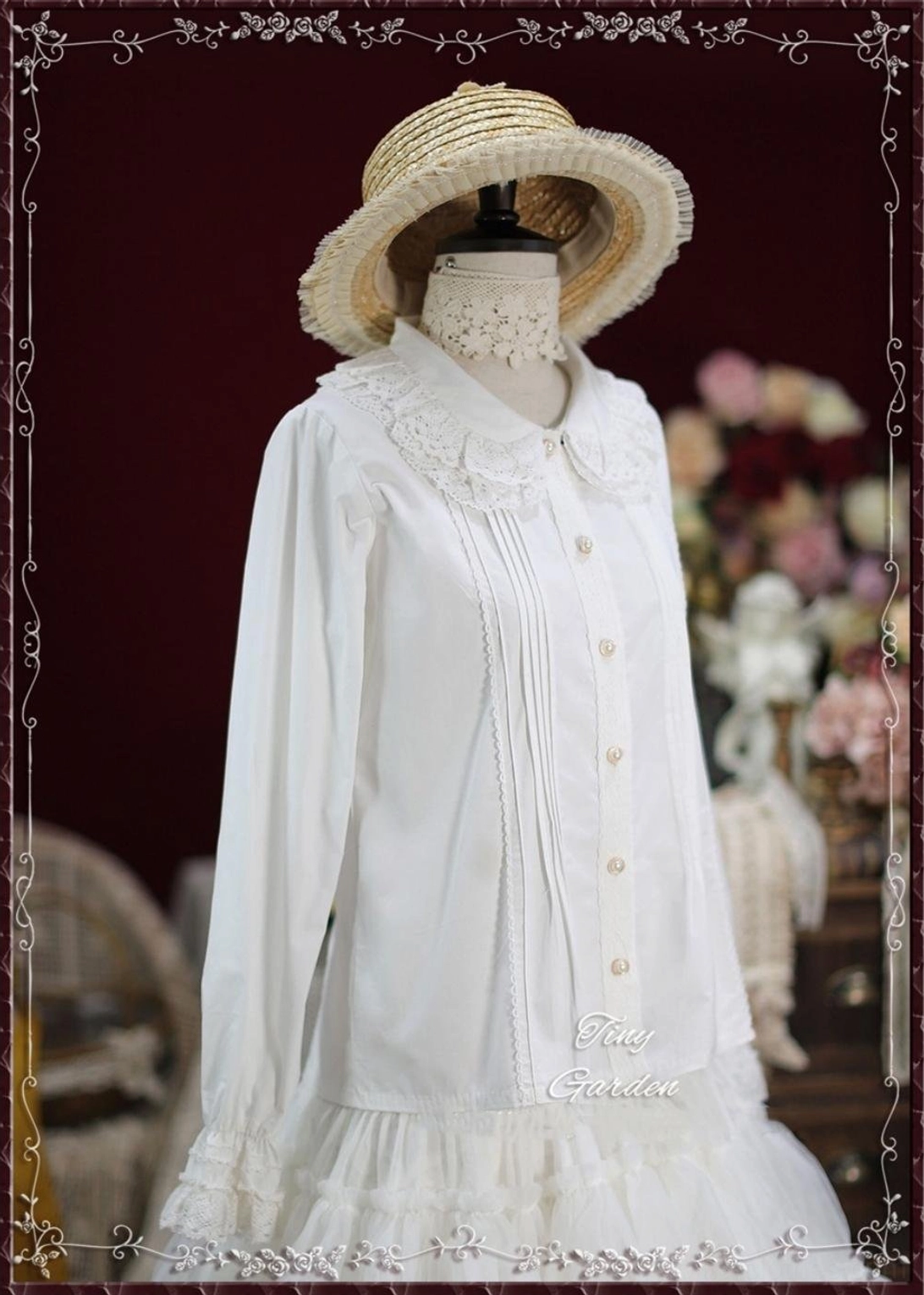 White vintage lace cotton Lolita blouse with Peter Pan collar side view on mannequin showing fitted sleeves and lace trimmed design