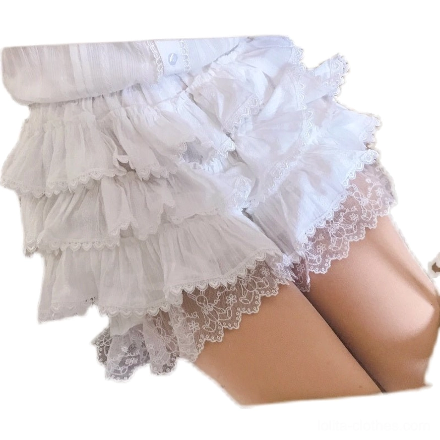 White lolita bloomer shorts flat lay close-up display showing subtle vertical stripe texture, multiple ruffle layers, sheer lace leg trim, and elastic waistband construction details