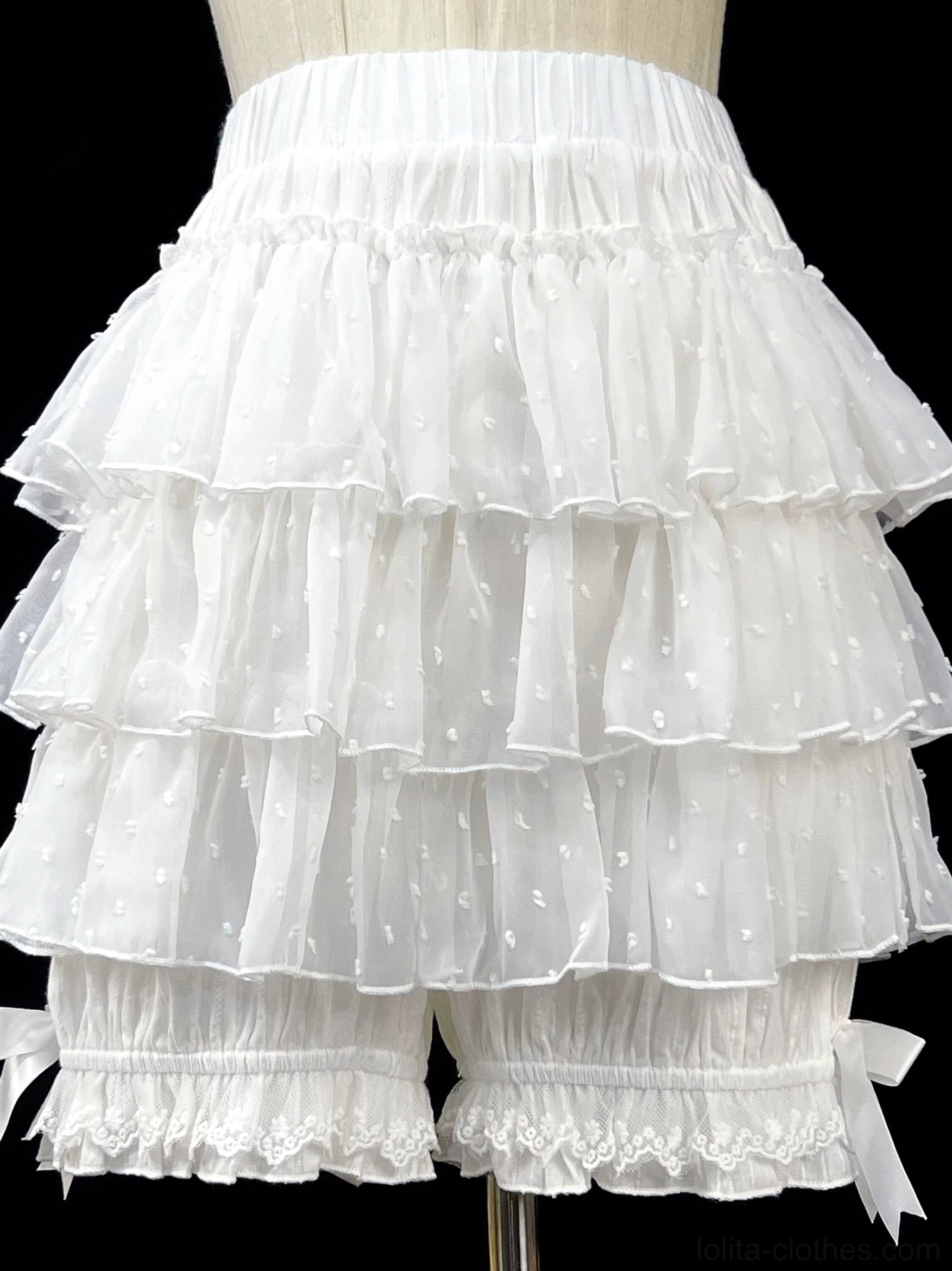 White lolita bloomers on dress form mannequin showing front view with lace-trimmed leg openings and tiered ruffled layers