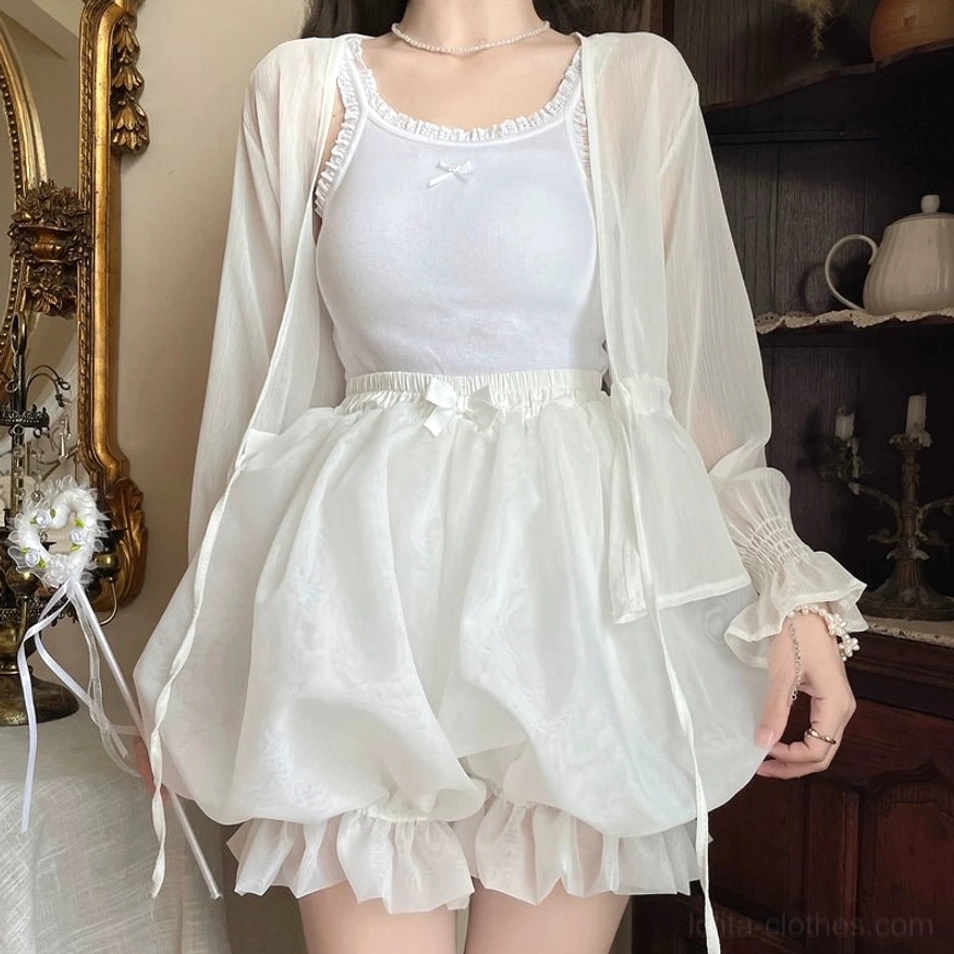 White organza lolita bloomers front close-up displaying voluminous puffiness triple-layer ruffled hem and long decorative side drawstrings