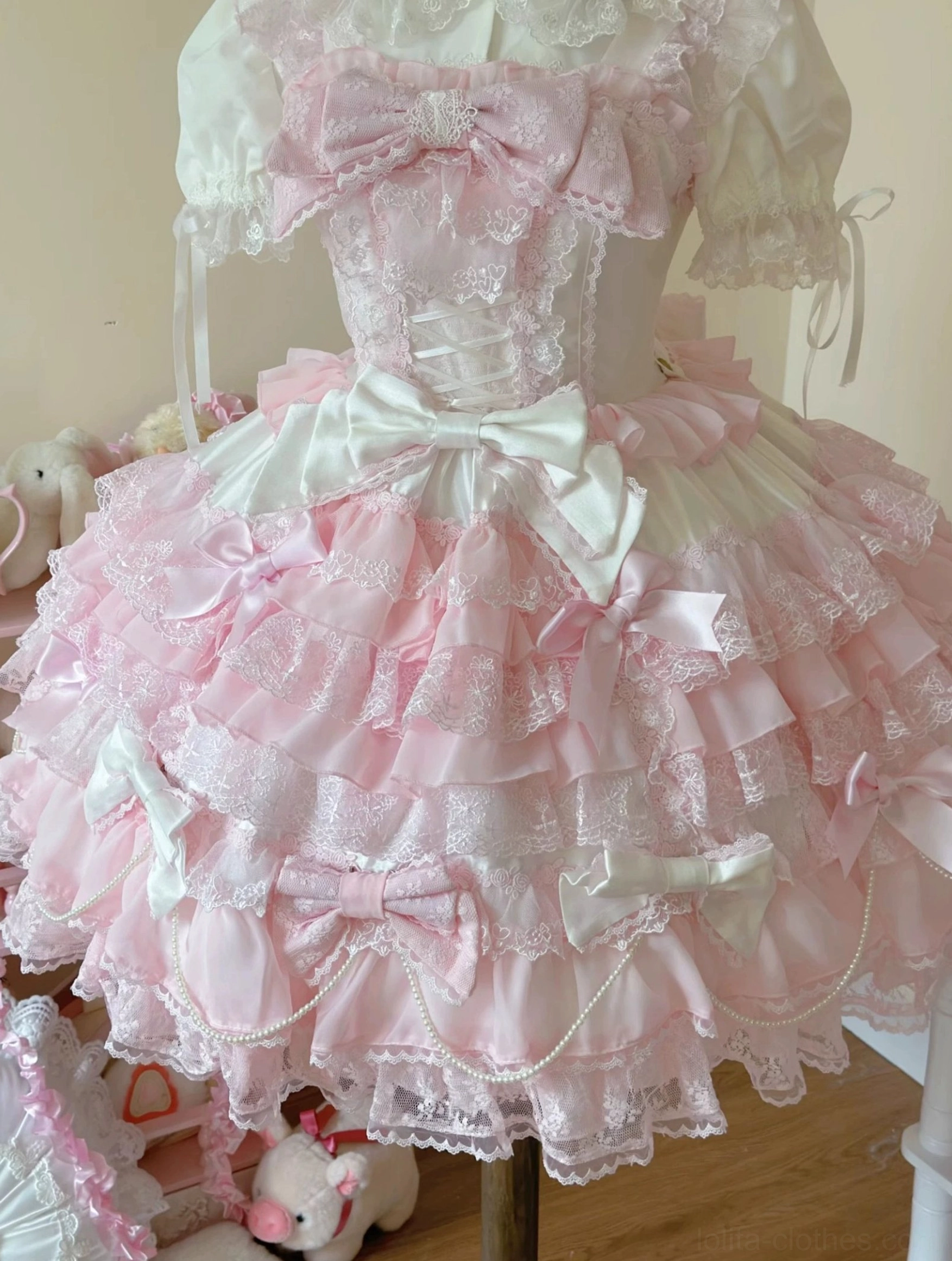 White lolita blouse coordinating piece flat lay showing peter pan doll collar lace and button closure details