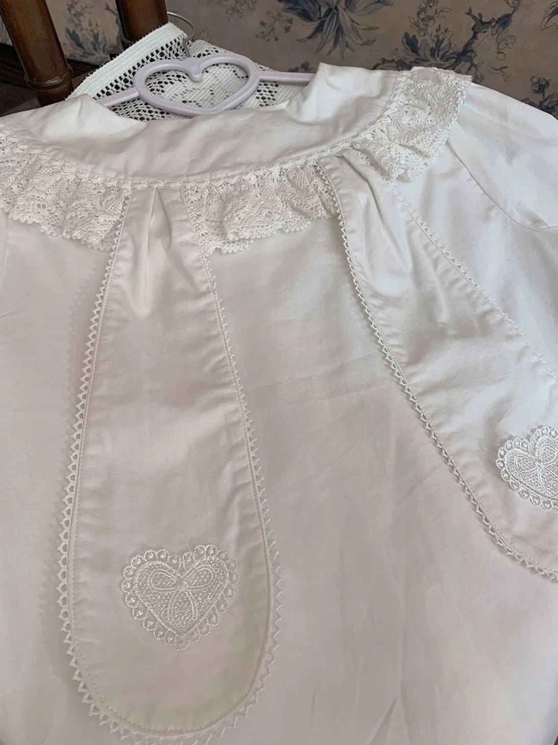 close-up detail white lolita blouse heart embroidery scalloped lace trim front placket delicate cotton texture