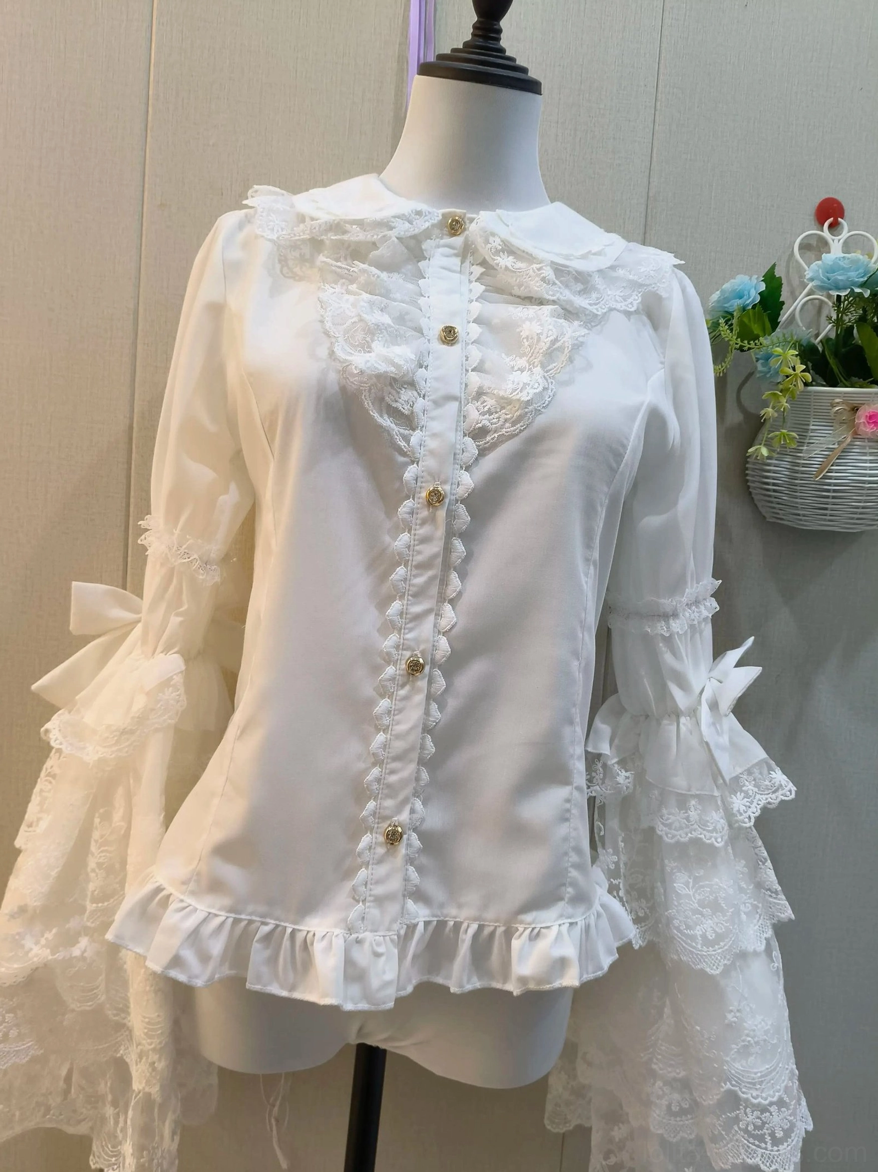 Sweet lolita white blouse slim fit with layered lace bell sleeves and satin bows, front mannequin display with flower basket
