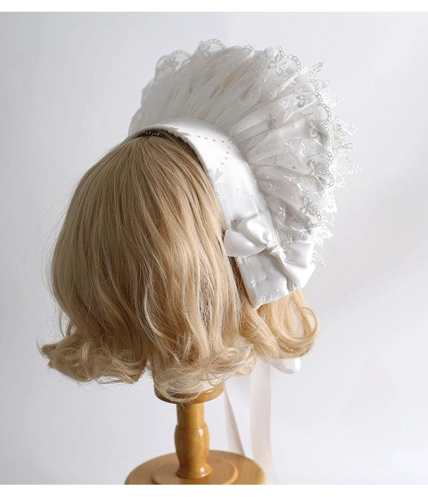 White lolita back-style bonnet accessory with large ruffled lace panel, satin bow rear back right side view on mannequin