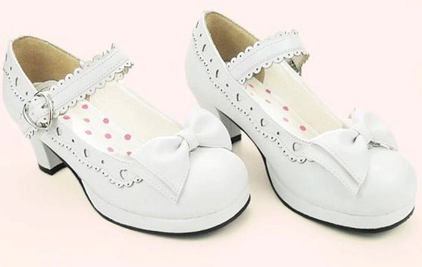 White lolita bow mary jane shoes three-quarter side view with heart-shaped ankle buckle and insole