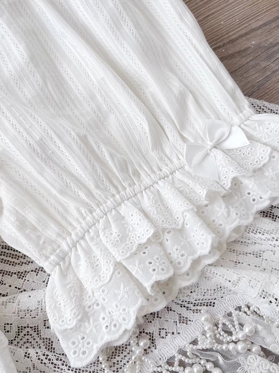White premium lolita elastic waist cotton bloomers front display featuring elasticated leg openings with ruffled lace construction, multi-layer embroidered lace hem detail, pristine white premium cotton fabric, and minimalist elegant design on clean neutral background