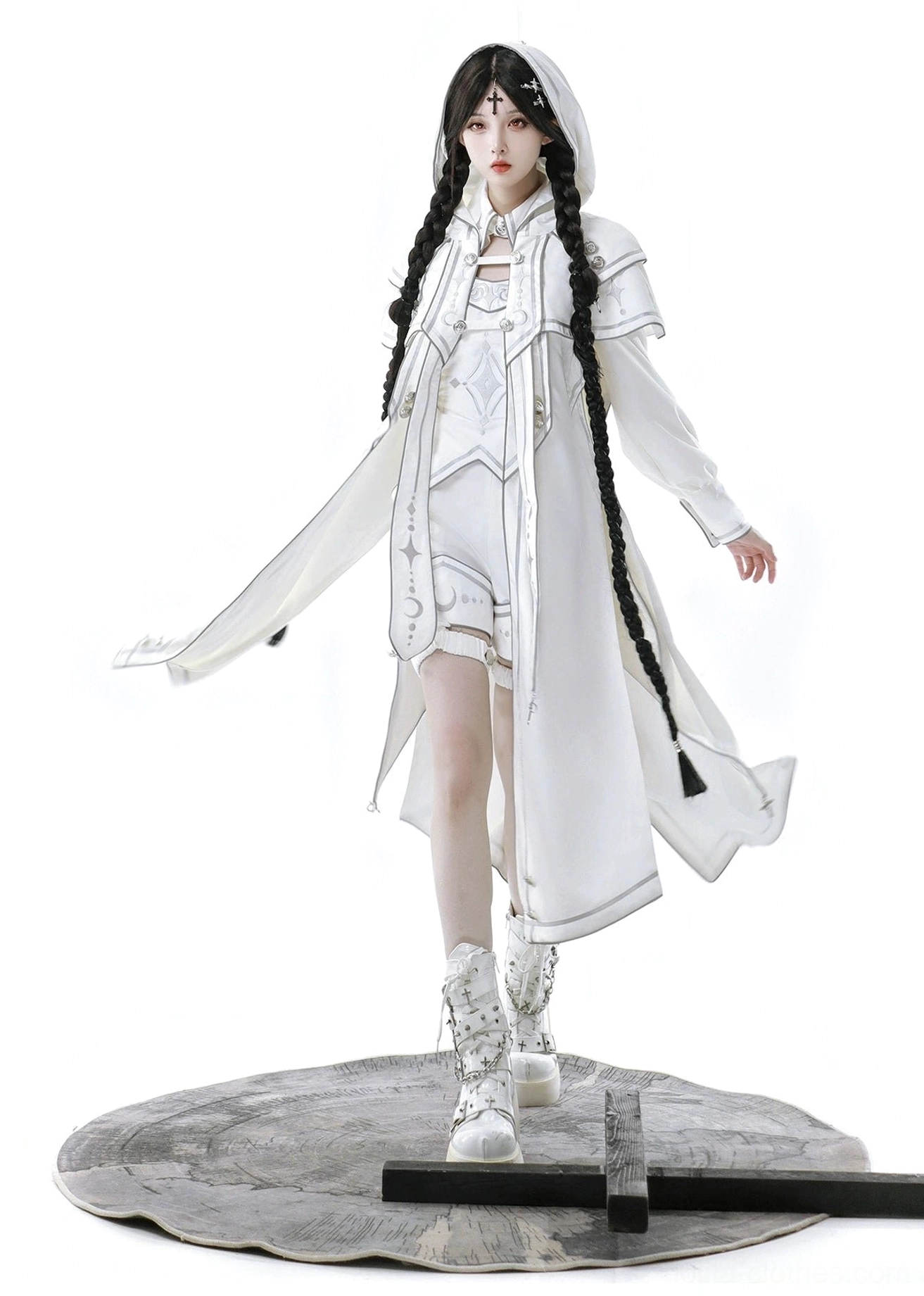 Front walking pose of punk ouji lolita white cloak set showing loose flowing cape hem, high-waisted structured shorts with functional pockets, and laced platform boots