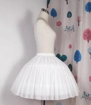 White Lolita puffy hoop petticoat left three-quarter angle view showing layered pleated soft sheer tulle construction and full rounded silhouette