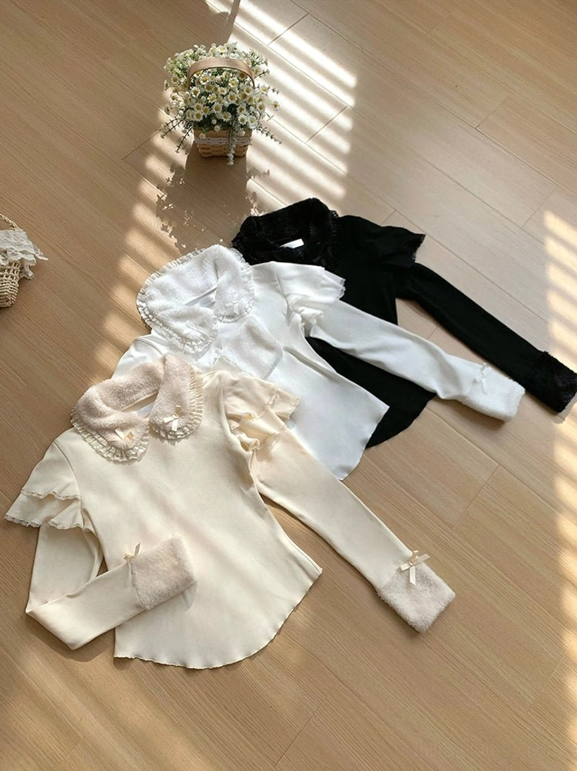 White lolita knit sweater ruffled flutter sleeve detail showing romantic wave design and delicate lace accent