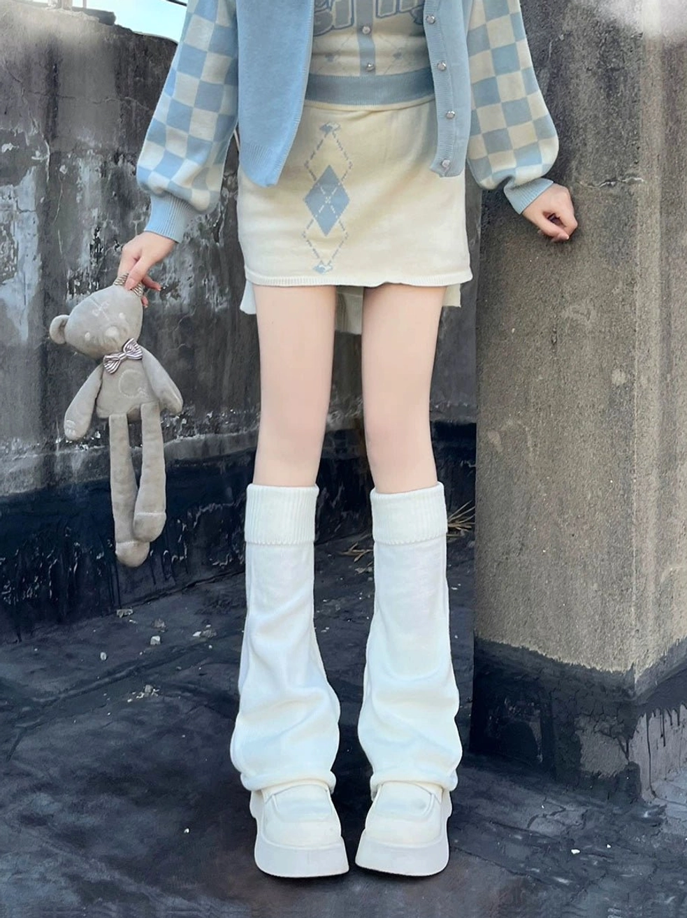 White slouchy lolita leg warmers front full body view outdoor rooftop checkered sleeve cardigan mini skirt plush toy