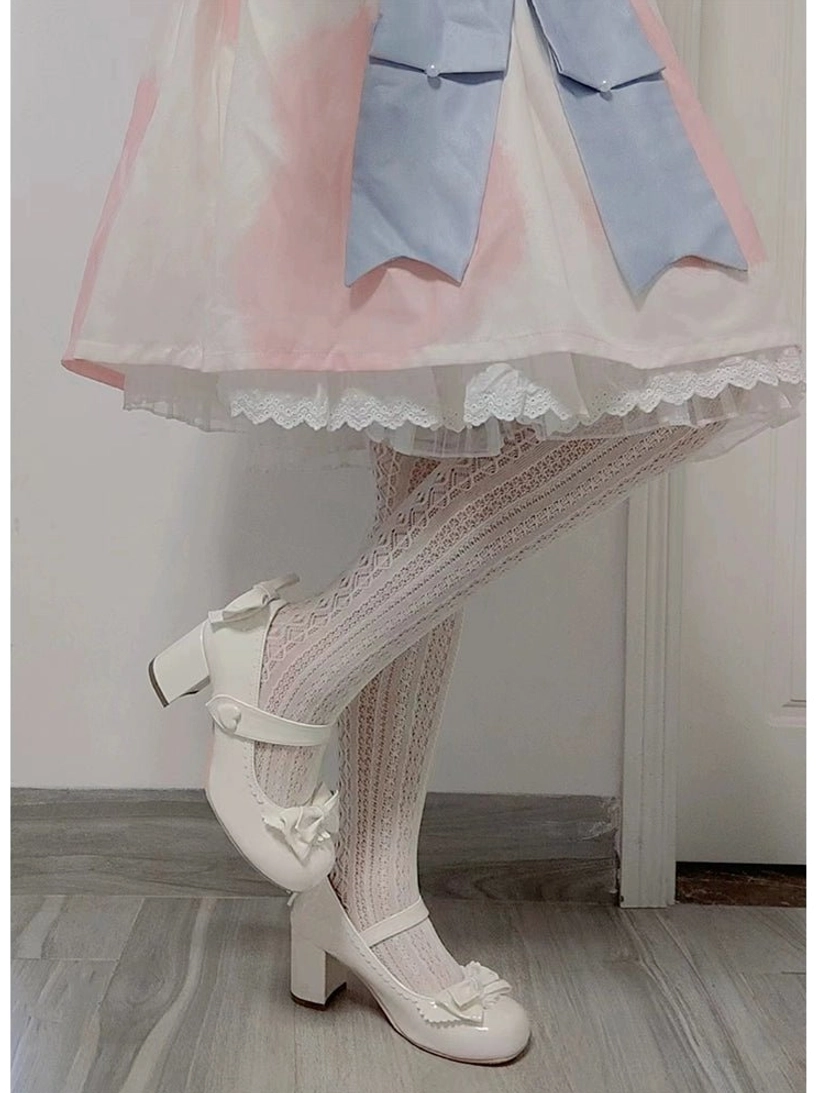 White Lolita Mary Jane low-heel shoes with ankle strap and round closed toe on girl wearing pink-blue Lolita skirt and lace thigh-high stockings full leg view