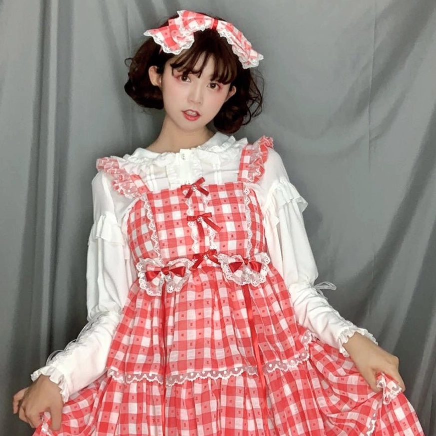White lolita mutton sleeve blouse with lace ruffled round neckline and tied cuffs front view