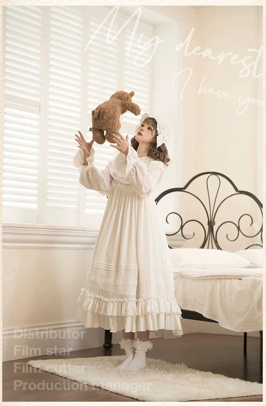 Premium white lolita one-piece dress with extended floor-length silhouette, voluminous ruffled skirt, and complete sweet lolita aesthetic perfect for conventions and alternative fashion