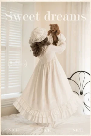 Back view of white sweet lolita one-piece with matching soft bonnet, displaying the cascading ruffled hem and high-waisted silhouette of this victorian-inspired dress
