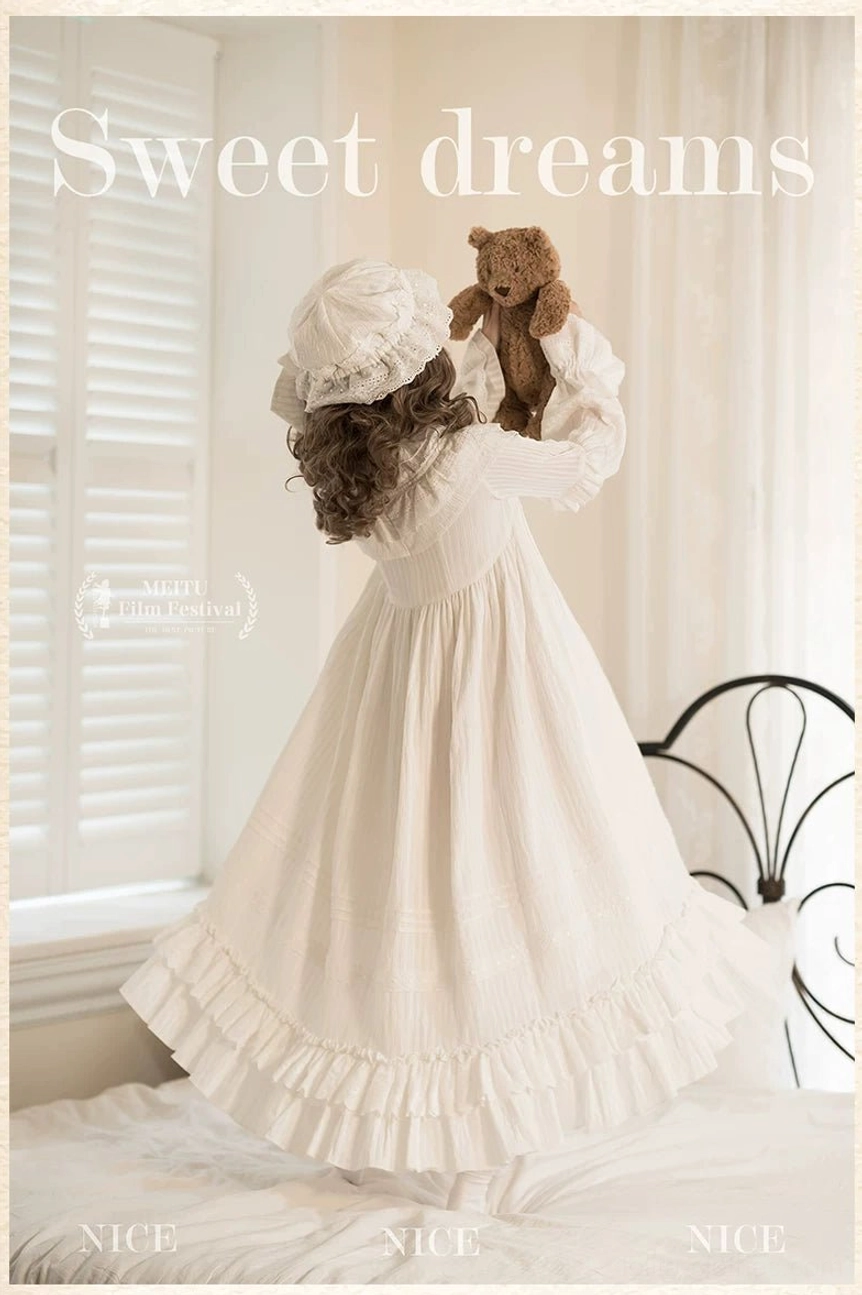 Back view of white sweet lolita one-piece with matching soft bonnet, displaying the cascading ruffled hem and high-waisted silhouette of this victorian-inspired dress