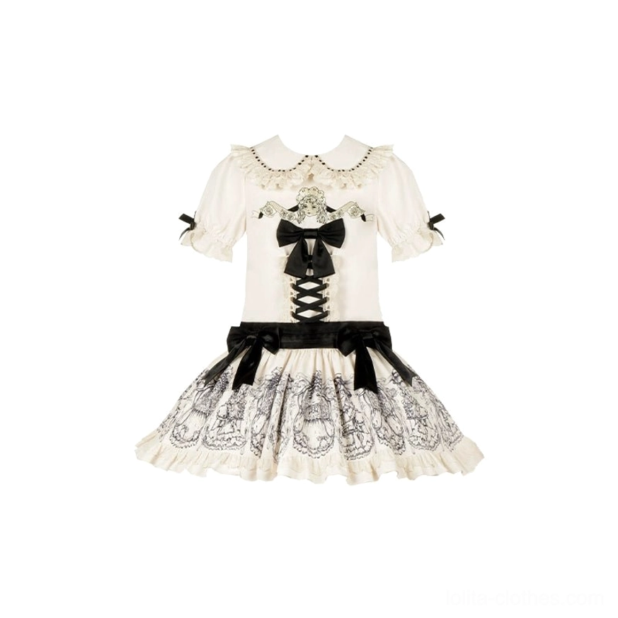 White vintage lolita OP dress set on flat lay - off-white peter pan collar with lace trim, front lace-up bow, velvet waist bow, and doll print skirt panel with ruffled hem