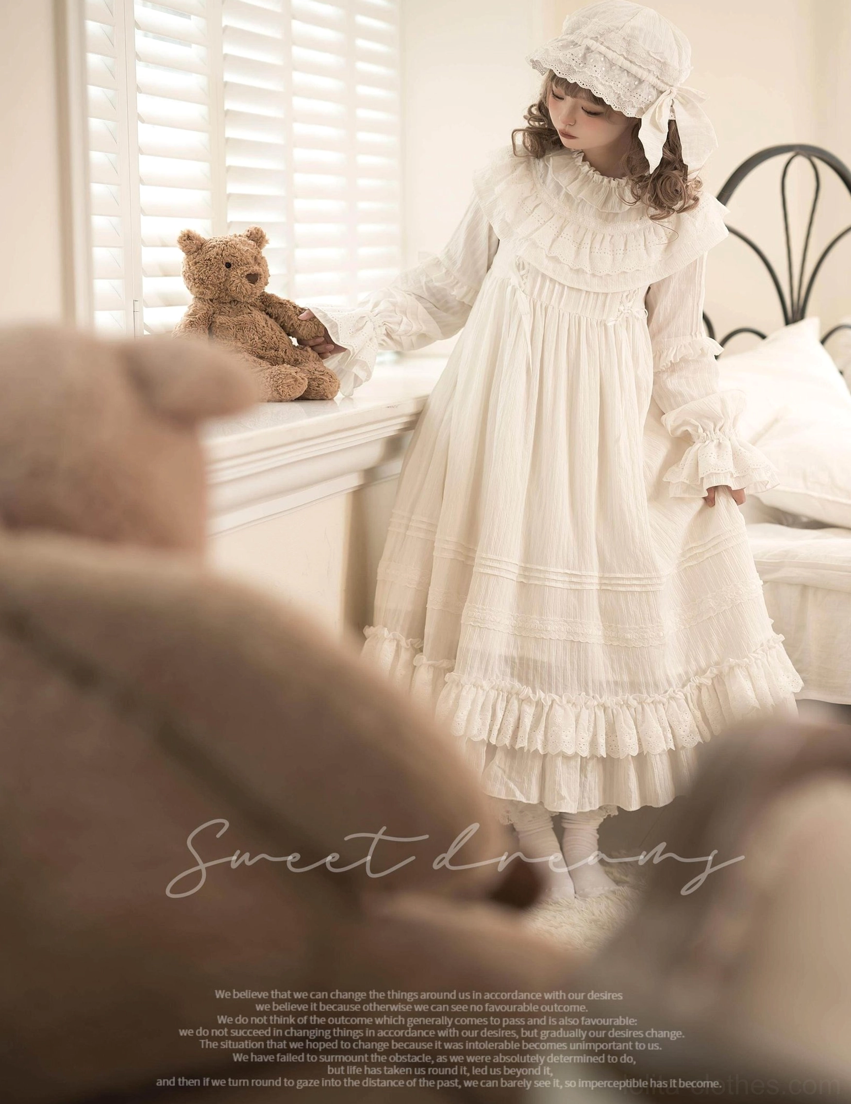 Side three-quarter shot of white lolita dress showcasing pleated bodice, ruffled cuffs, and soft-woven fabric texture that defines this ethereal victorian-inspired design