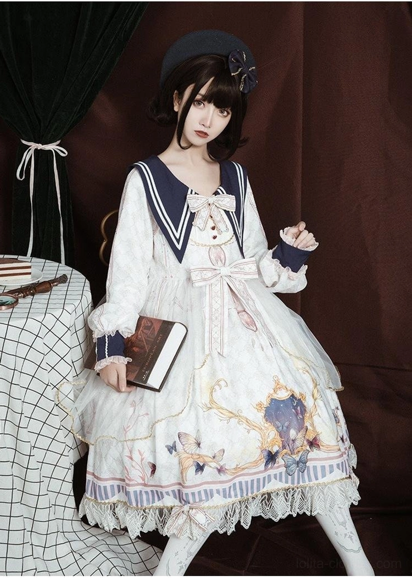 White sailor collar lolita one-piece dress front half-body and full-body view on model with dark curly hair and black beret, holding vintage book, baroque floral print, lace-trimmed flared skirt, bow decorations collar and waist