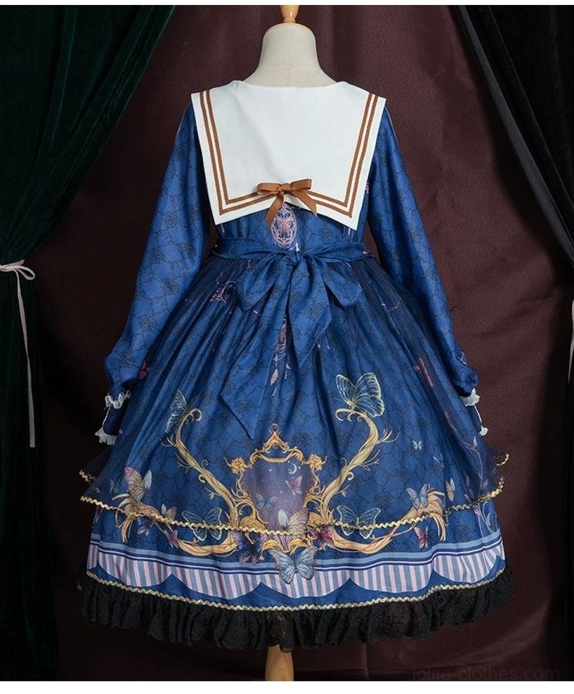 White sailor collar lolita op dress on model layered with long sleeve blouse, black patent mary jane shoes, extending seasonal wearability, cool weather styling