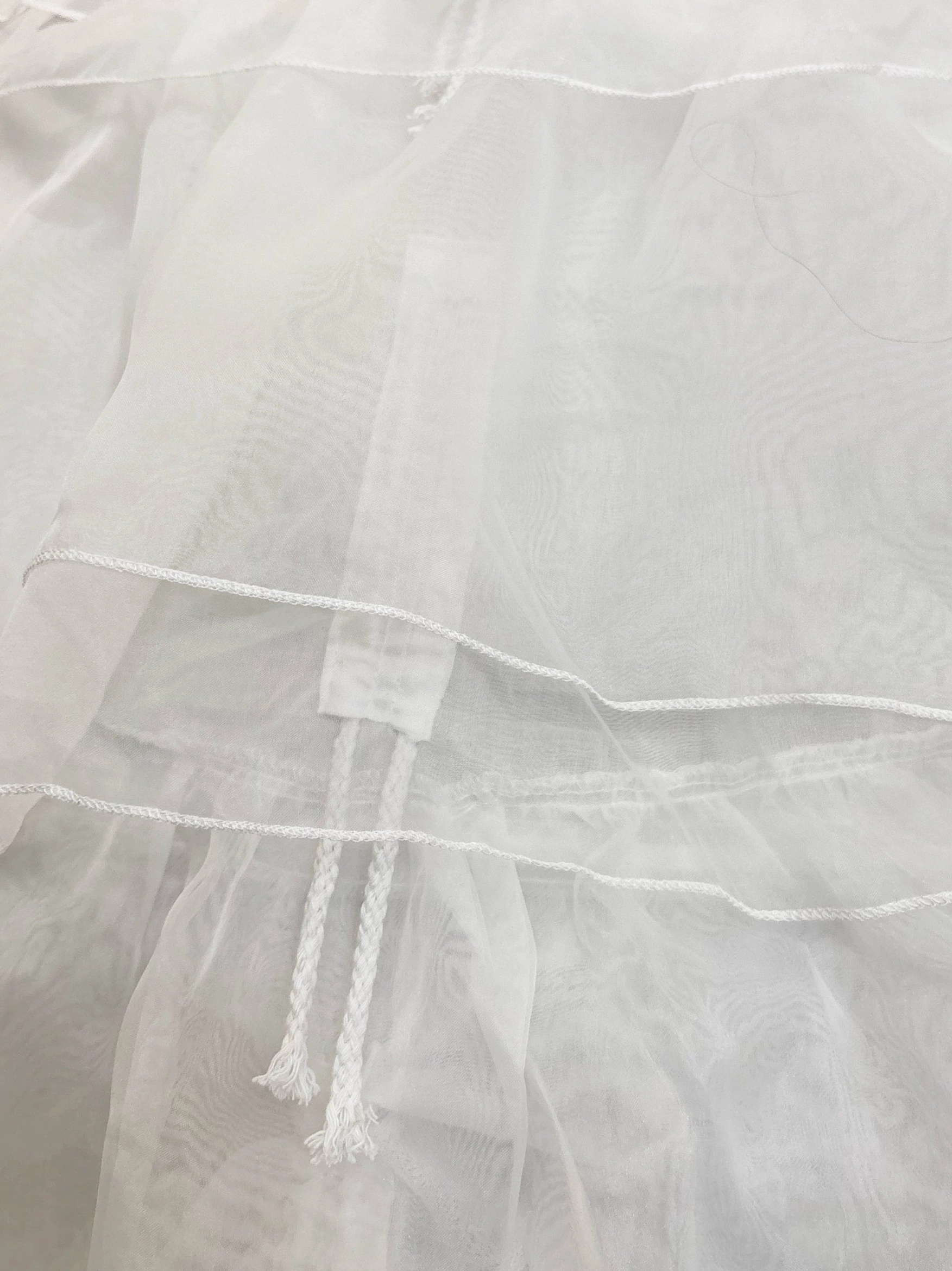 White triple-layer organza Lolita petticoat detail shot emphasizing organza fabric quality, hoop structure, and layered volume construction