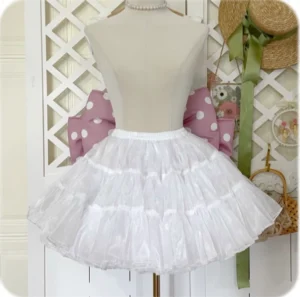 White tiered lolita petticoat front view on dress form with multi-layer ruffled tulle silhouette and cute indoor backdrop