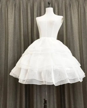 Overhead front view of white organza Lolita petticoat displaying three-tier ruffled construction and uniform bell-shaped volume