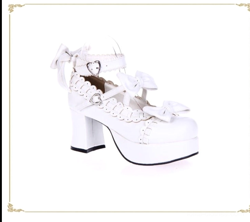 White lolita platform high heels side three-quarter view all-white finish bow decorations chunky platform sole heart-shaped buckle