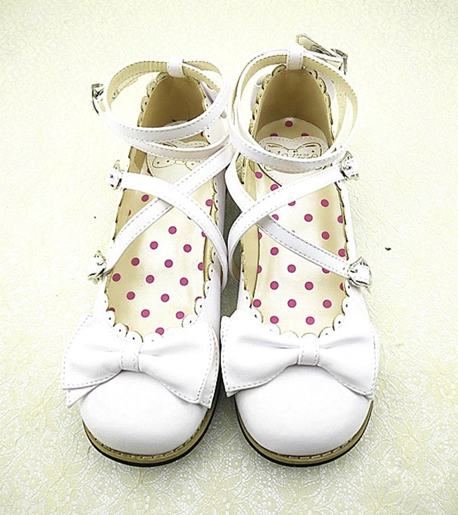 White Lolita low heel princess shoes minimalist bowless style with cross white ankle straps and metal buckles, plain round toe cap, polka dot inner sole, and scalloped shoe trim