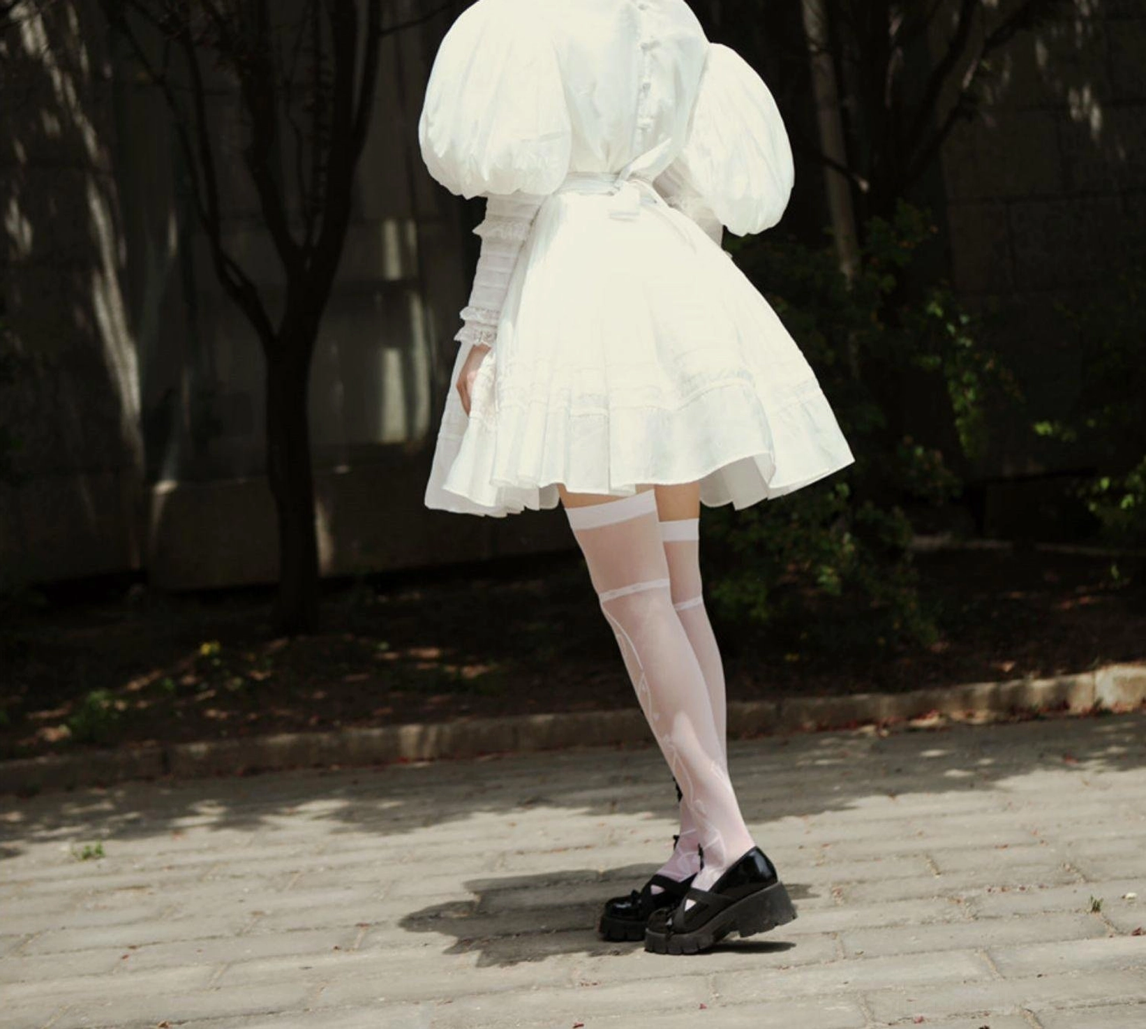 White Victorian Lolita blouse oversized puff sleeve detail showing voluminous bubble silhouette, layered ruffled cuff, and sheep-leg gigot sleeve construction characteristic of 19th-century Victorian fashion