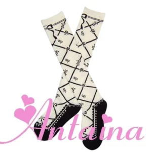 white base lolita socks black argyle floral print bow motif faux leather toe cap heel styling crossed flat lay front view