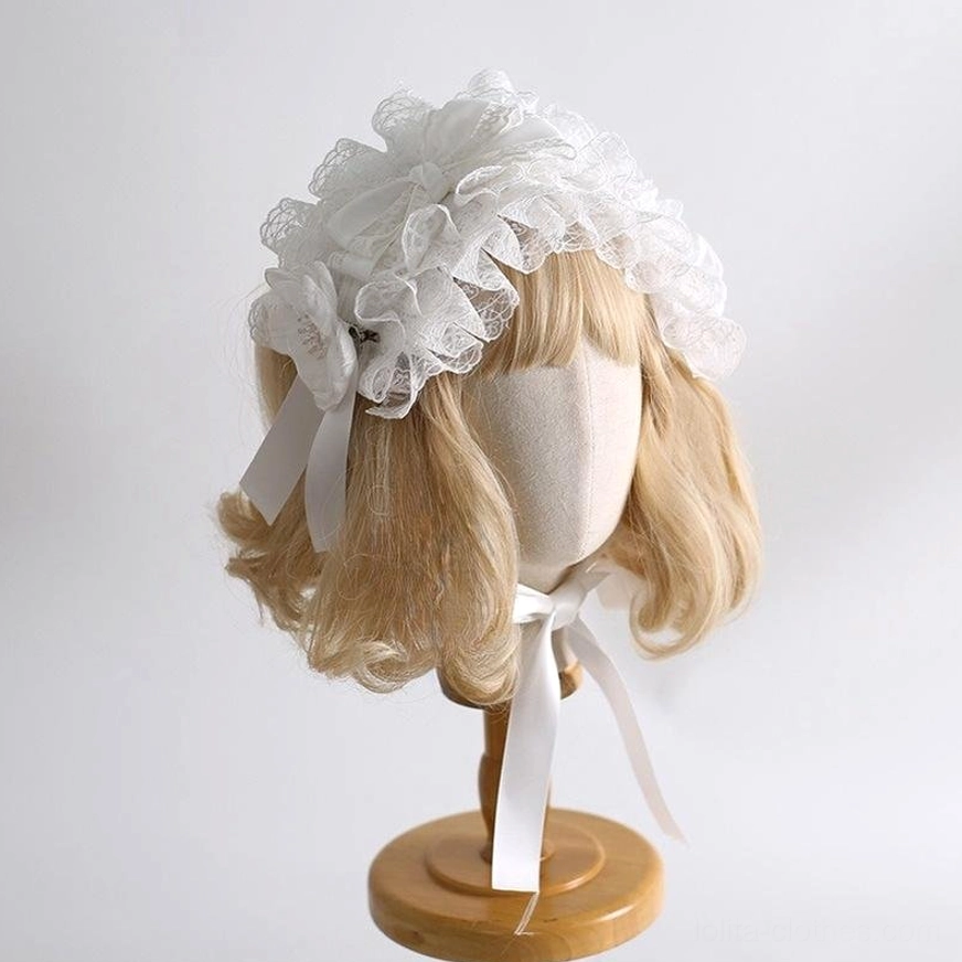 White lolita lace headband with layered ruffled lace, side satin ribbons, soft feminine design front three-quarter view