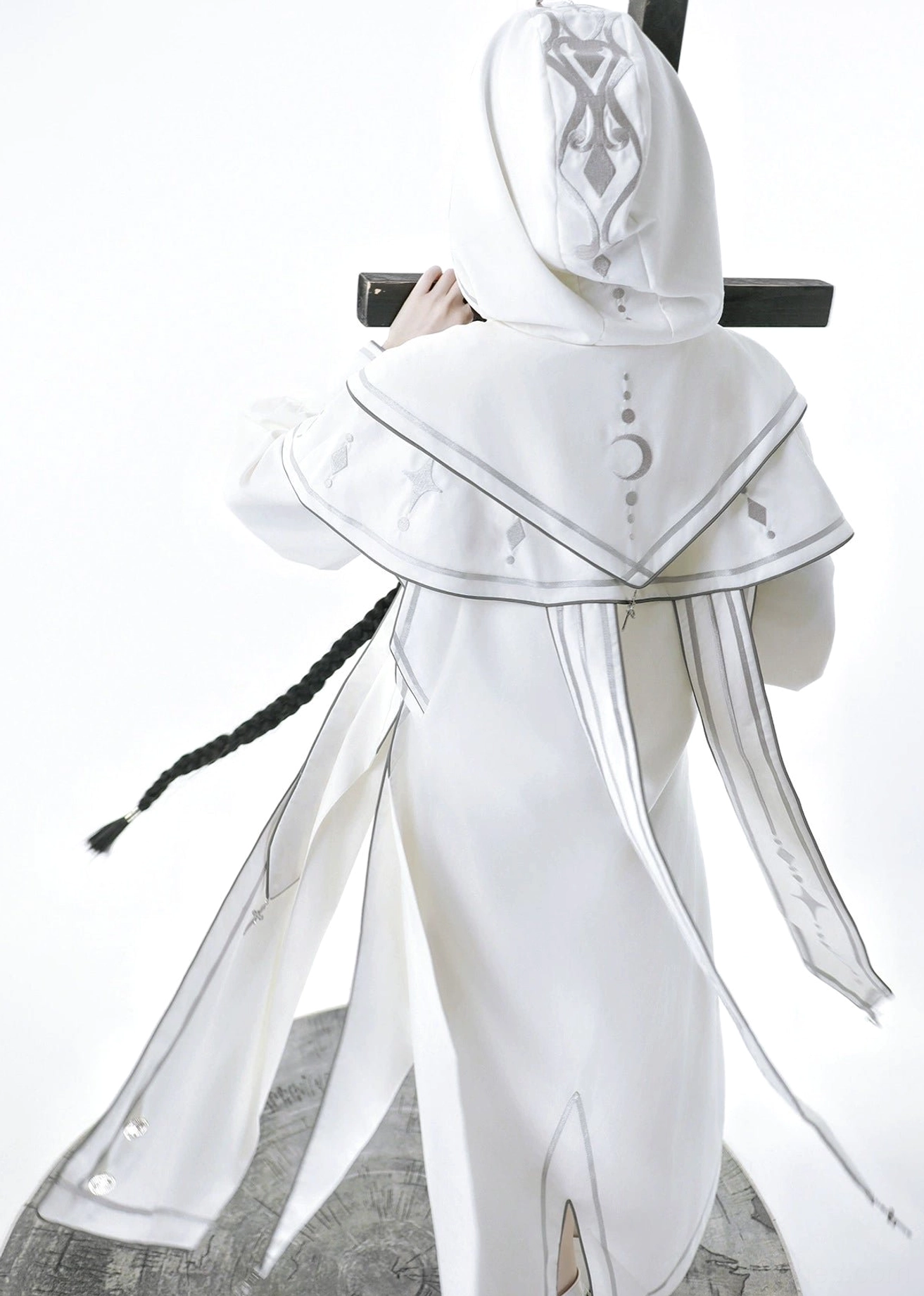 Close-up of punk ouji lolita top showing mutton sleeves with buttoned cuffs, detachable waist ties, high neckline, and intricate embroidery detail work