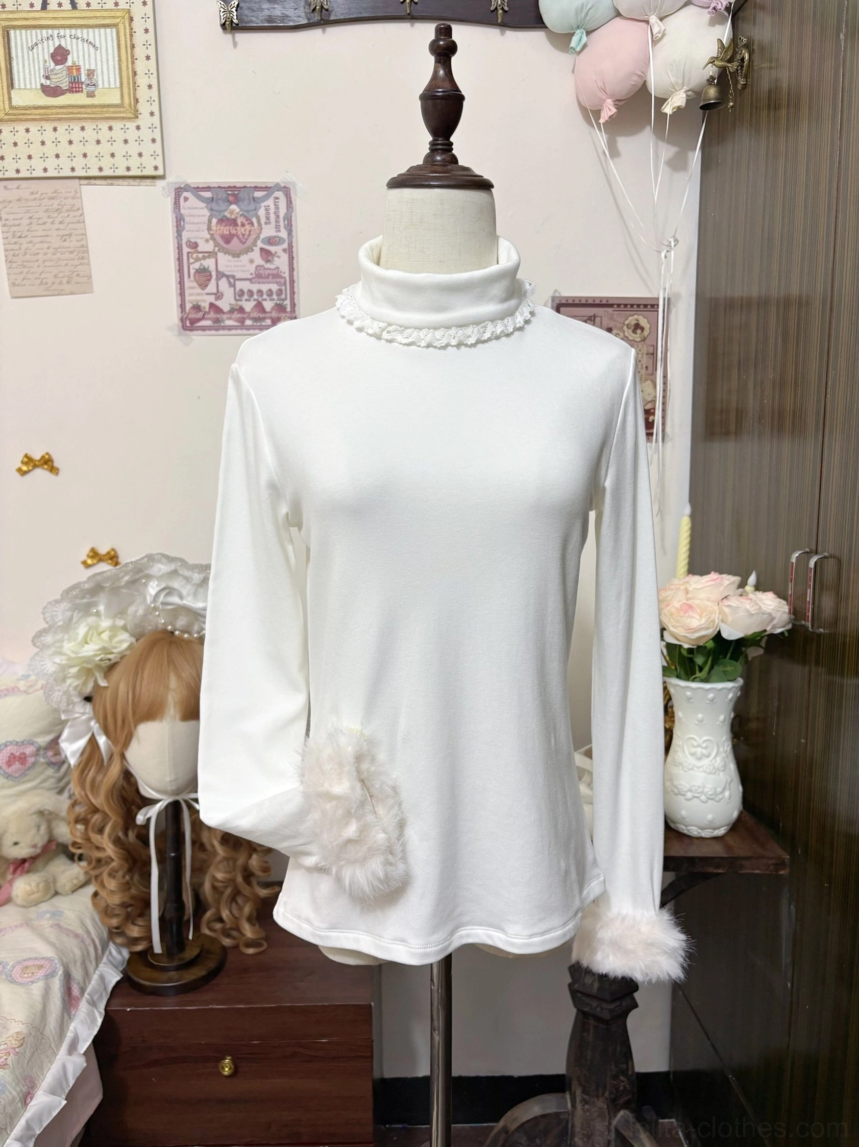 Three-quarter angle view of white lolita turtleneck inner wear showing decorative fuzzy pocket lace-trimmed collar and plush fur cuff details on display mannequin