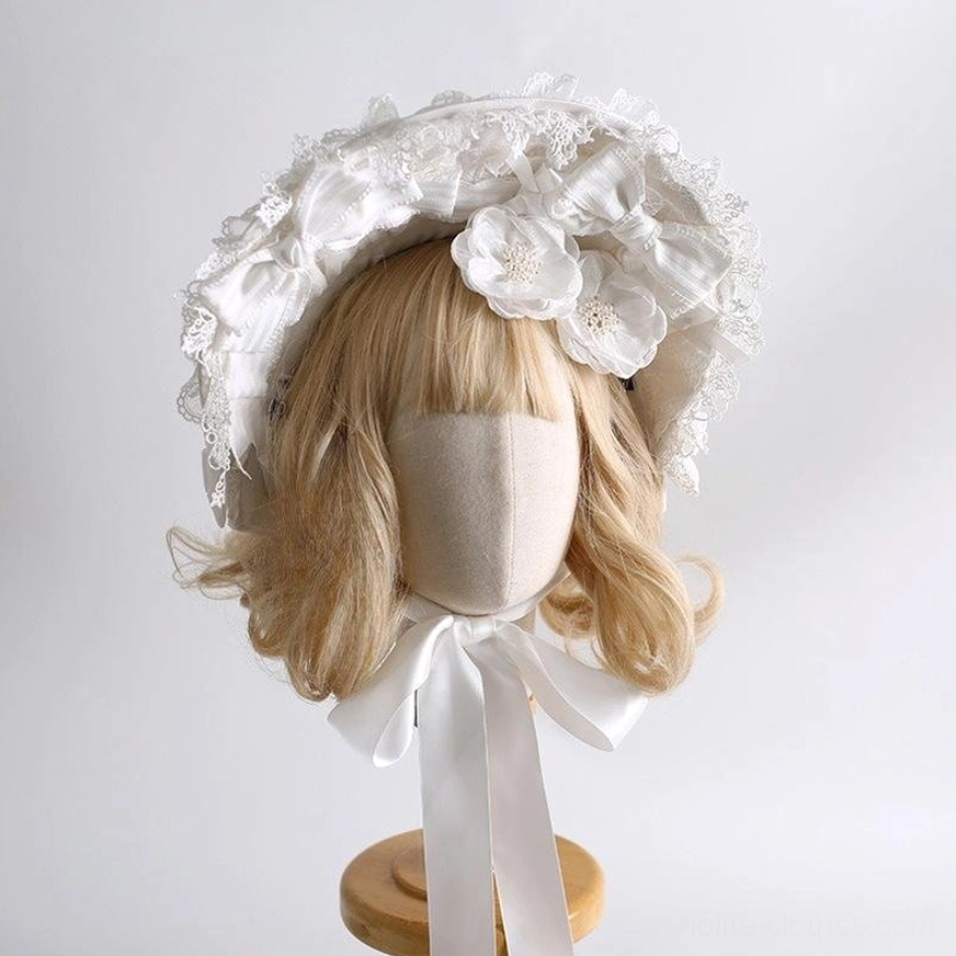 White lolita vintage bonnet headwear with lace-trimmed frame, satin flower accents, elegant all-white design right three-quarter view