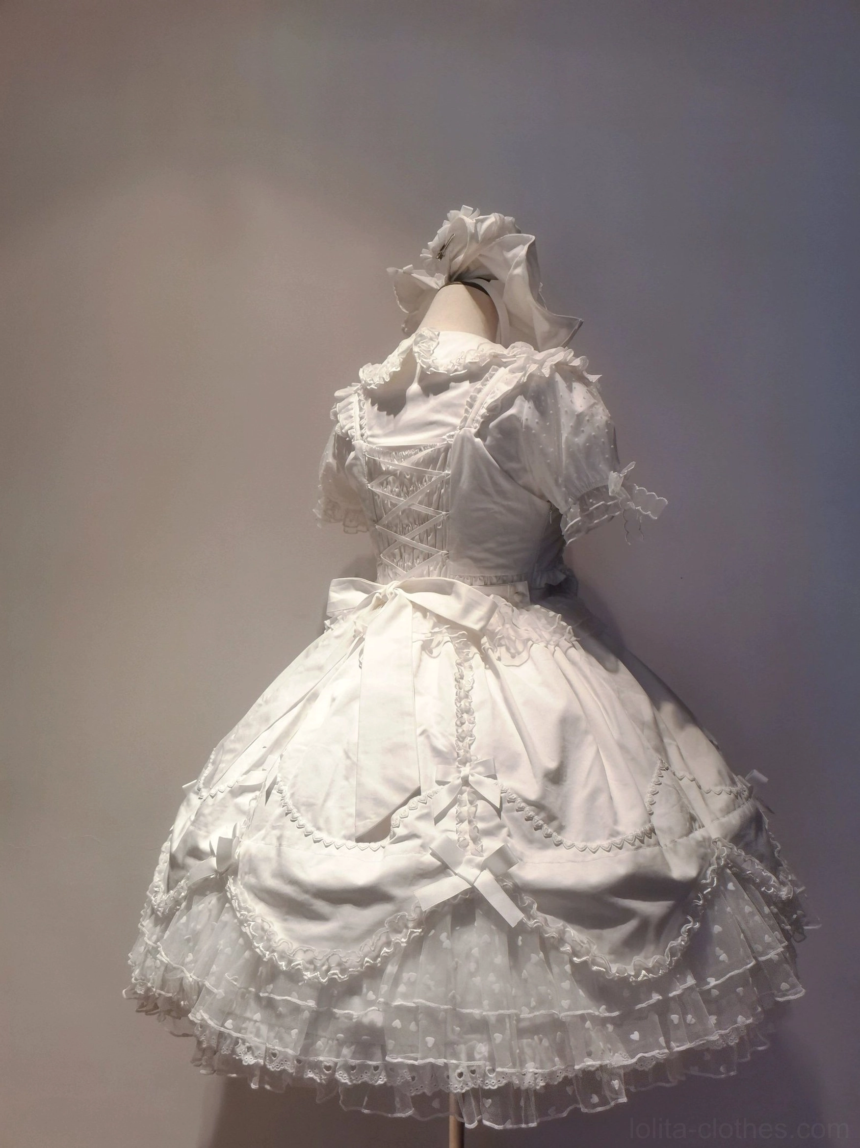 White wrist cuffs pair for sweet Lolita dress with delicate lace trim and bow accent