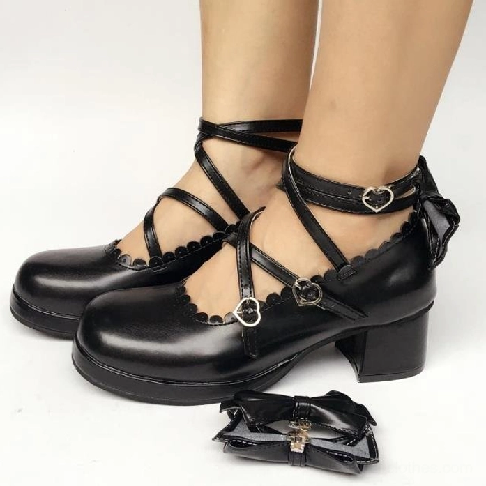 White matte sweet Lolita Mary Jane platform shoe with crisscross straps, scalloped inner collar detail, and decorative bow elements